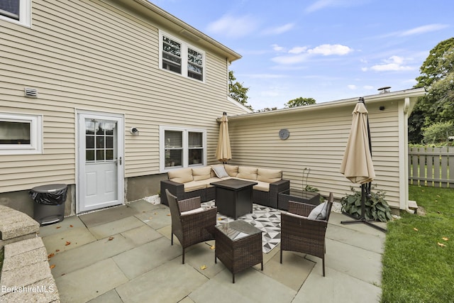 view of patio / terrace featuring outdoor lounge area and fence