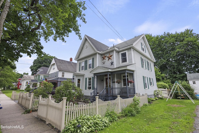 16 Summer St, Adams, MA 01220 - victorian-style house with a porch and a fenced front yard