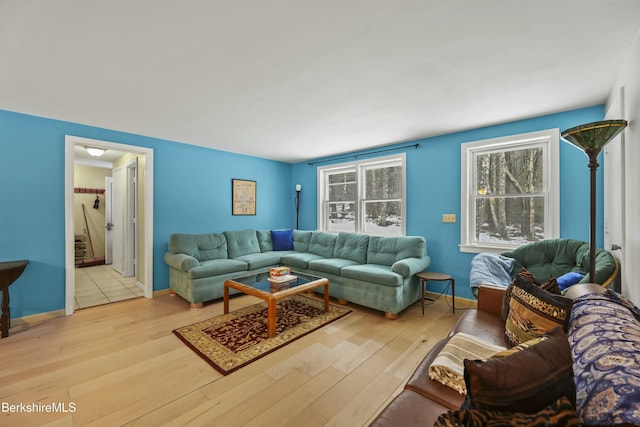 living room featuring baseboards and wood finished floors