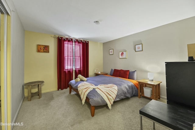 carpeted bedroom with baseboards