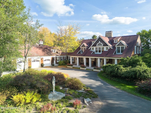 cape cod house with a garage