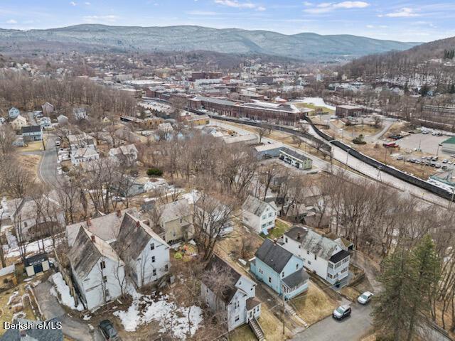 drone / aerial view featuring a mountain view