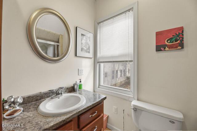 bathroom with vanity and toilet