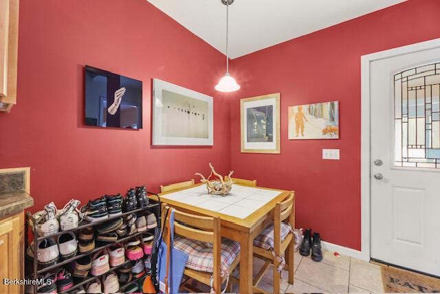 dining area with light tile patterned floors