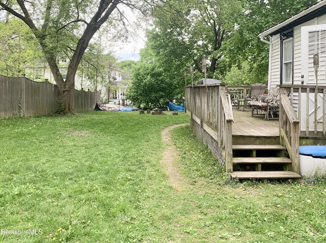 view of yard with a wooden deck