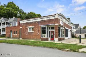 view of front of home featuring brick siding