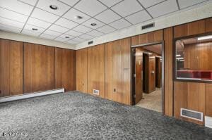 interior space featuring wooden walls