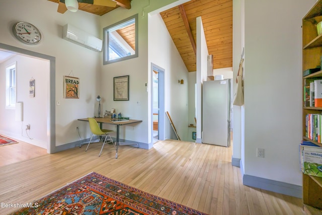 812 Canaan Southfield Rd, New Marlborough, MA 01259 - corridor featuring a wall mounted air conditioner, wood-type flooring, an upstairs landing, high vaulted ceiling, and baseboards