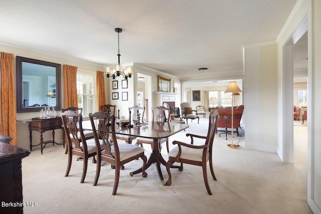 dining room with light carpet, ornamental molding, a chandelier, and a healthy amount of sunlight