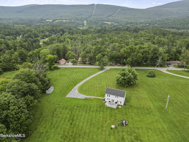 679 Middle Pownal Rd, Pownal, VT 05261 - aerial view of property and surrounding area with a heavily wooded area and a mountainous background