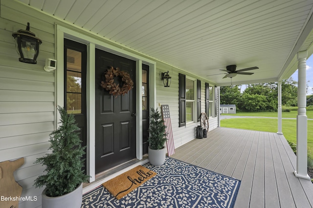 679 Middle Pownal Rd, Pownal, VT 05261 - wooden porch with a yard and ceiling fan
