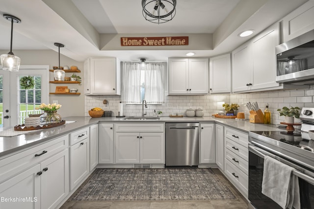679 Middle Pownal Rd, Pownal, VT 05261 - kitchen featuring stainless steel appliances, white cabinets, backsplash, and light countertops