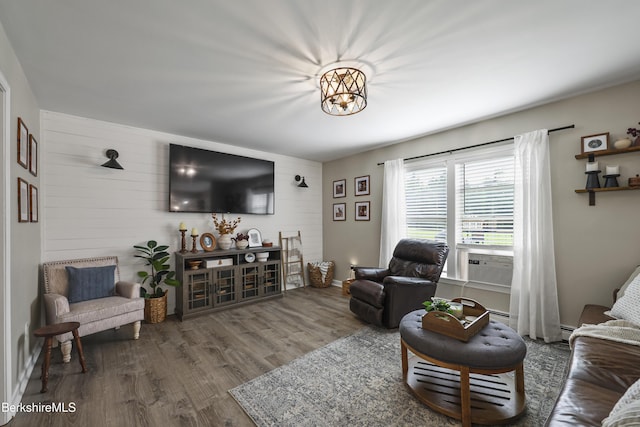 679 Middle Pownal Rd, Pownal, VT 05261 - living room featuring wood finished floors, wood walls, and cooling unit