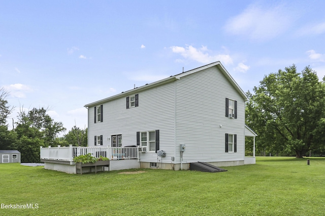 679 Middle Pownal Rd, Pownal, VT 05261 - back of house with a wooden deck, a lawn, and a shed