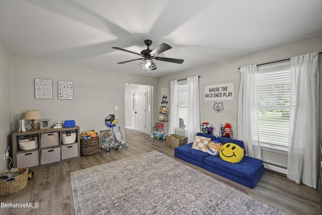 679 Middle Pownal Rd, Pownal, VT 05261 - game room with a baseboard radiator, a ceiling fan, and wood finished floors