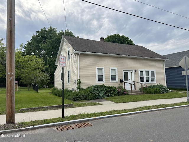 18 Crotteau St, Adams, MA 01220 - view of front of property with a chimney, a front yard, and a shingled roof