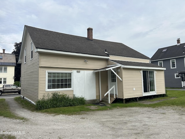 18 Crotteau St, Adams, MA 01220 - rear view of property with entry steps, a chimney, and a shingled roof