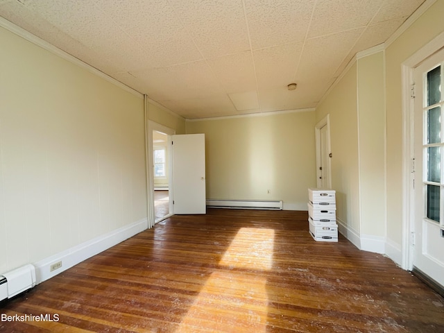 unfurnished room with hardwood / wood-style floors, crown molding, baseboard heating, and plenty of natural light