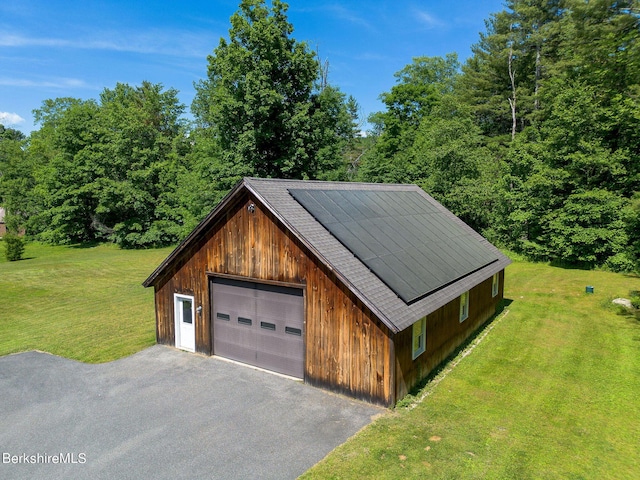 garage with a lawn