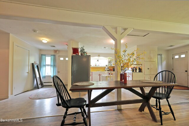 458 Monterey Rd, Great Barrington, MA 01230 - dining area with a baseboard heating unit, plenty of natural light, and light wood-type flooring