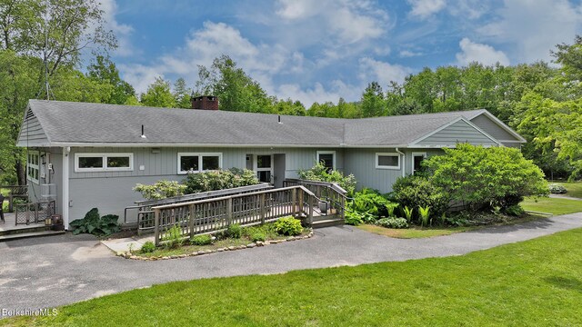 458 Monterey Rd, Great Barrington, MA 01230 - ranch-style home featuring a chimney, a deck, a front lawn, and roof with shingles