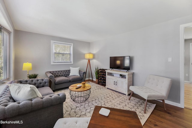 living room with light wood-style floors and baseboards