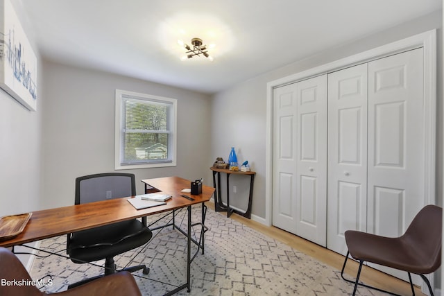 office featuring light wood-style floors and baseboards