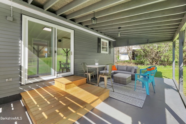 view of patio / terrace with outdoor dining area, outdoor lounge area, and a deck