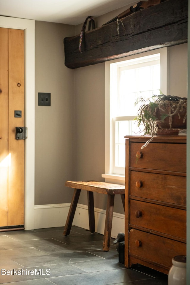 interior space featuring baseboards