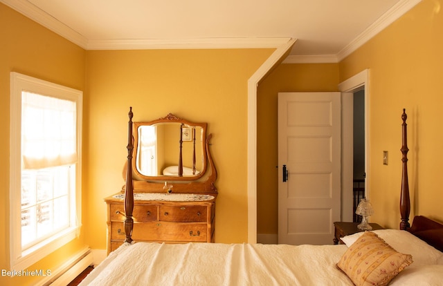 bedroom with a baseboard heating unit and crown molding