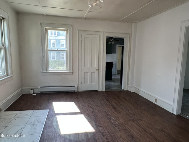 287 Houghton St, North Adams, MA 01247 - spare room with a baseboard heating unit, wood finished floors, healthy amount of natural light, and baseboards
