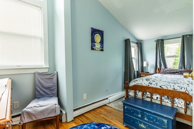 144 Brombach St, Pittsfield, MA 01201 - bedroom featuring baseboard heating, wood finished floors, vaulted ceiling, and baseboards