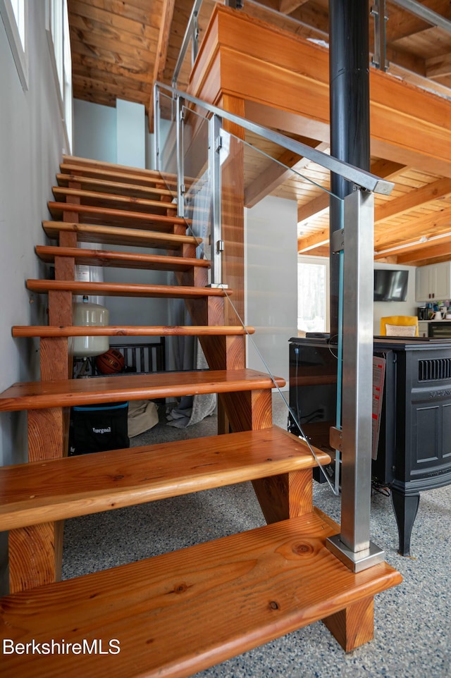 staircase with wooden ceiling