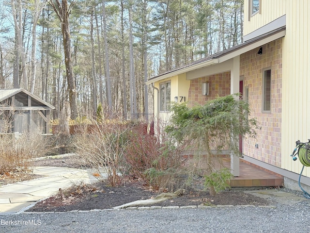 view of home's exterior with brick siding