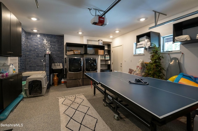 recreation room with a garage, recessed lighting, and washer and clothes dryer