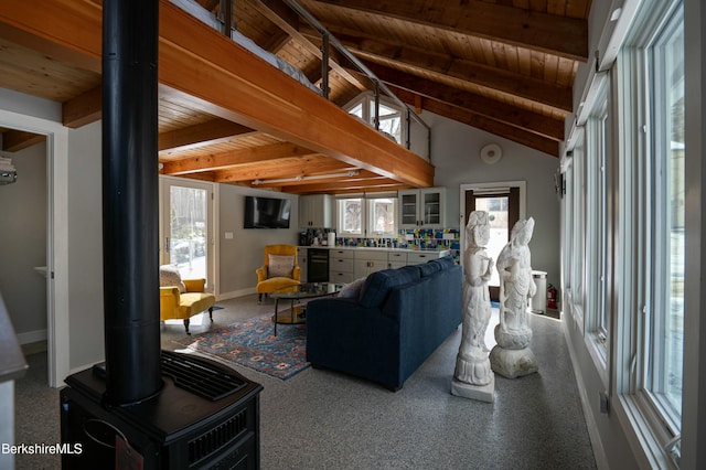 living area featuring wood ceiling, beverage cooler, beamed ceiling, and a wood stove