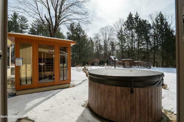 exterior space with a hot tub