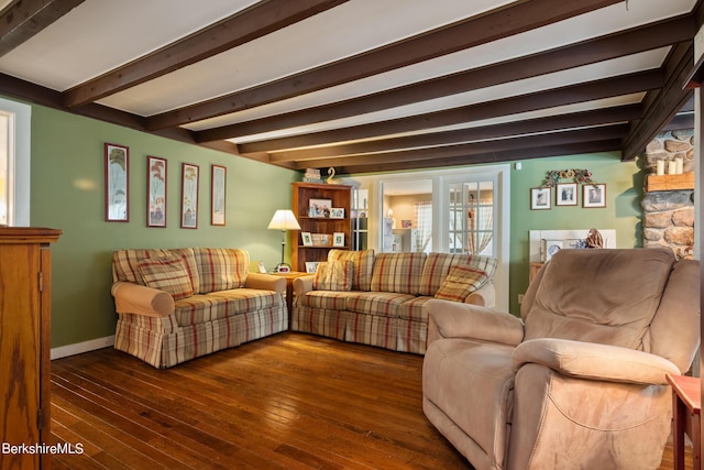 living room with beamed ceiling and dark hardwood / wood-style floors