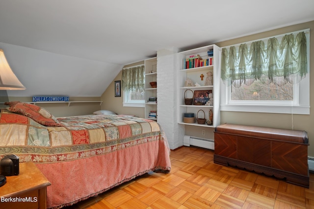 bedroom featuring light parquet floors, a baseboard radiator, and vaulted ceiling