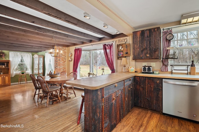 kitchen featuring dishwasher, kitchen peninsula, light hardwood / wood-style flooring, beam ceiling, and dark brown cabinetry