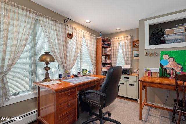 home office with a wealth of natural light and a baseboard heating unit