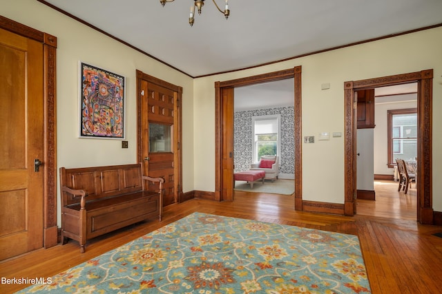 163 Cole Ave, Williamstown, MA 01267 - entrance foyer with hardwood / wood-style flooring, a chandelier, and crown molding