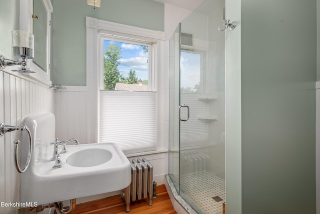 163 Cole Ave, Williamstown, MA 01267 - full bath featuring radiator heating unit, a stall shower, wood finished floors, and wainscoting