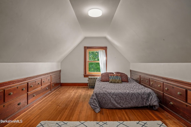 163 Cole Ave, Williamstown, MA 01267 - bedroom with radiator, wood-type flooring, and vaulted ceiling