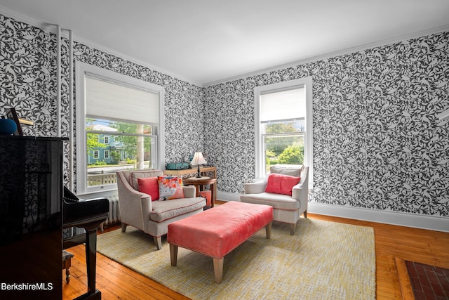 163 Cole Ave, Williamstown, MA 01267 - living area with wallpapered walls, hardwood / wood-style flooring, ornamental molding, plenty of natural light, and a fireplace