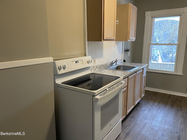 23-27 Gallup St, North Adams, MA 01247 - kitchen with white electric range, dark wood finished floors, light countertops, and light brown cabinetry