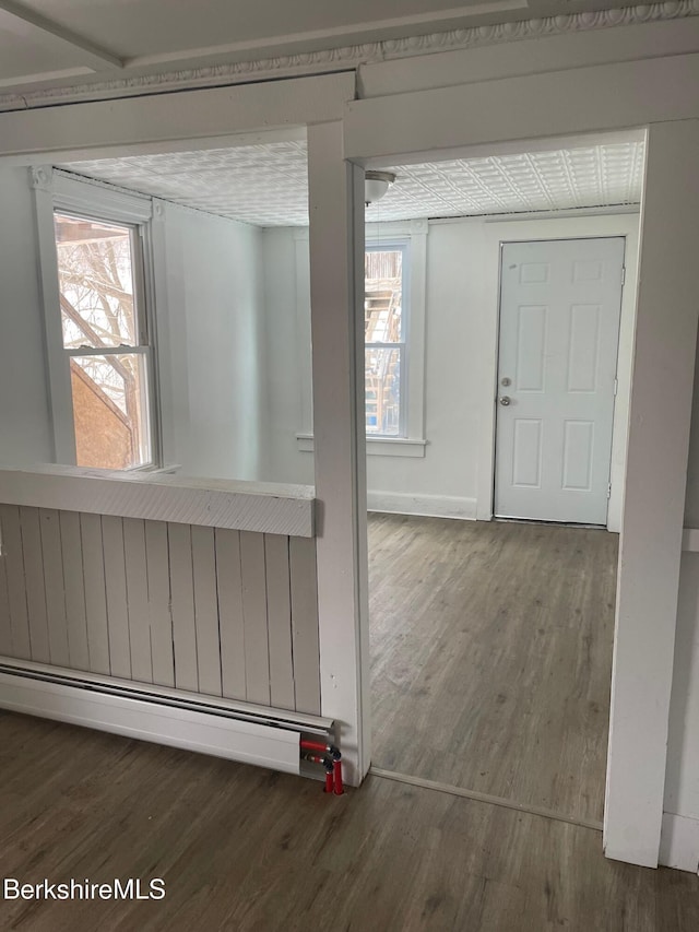 23-27 Gallup St, North Adams, MA 01247 - corridor with a baseboard heating unit, wood finished floors, and plenty of natural light