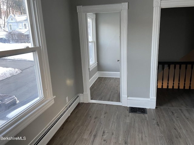 23-27 Gallup St, North Adams, MA 01247 - unfurnished room with baseboard heating and wood finished floors