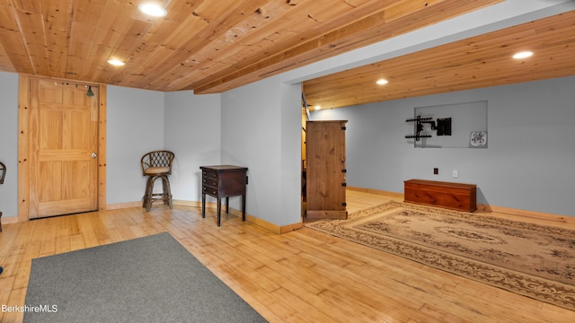 sitting room with wood-type flooring and wood ceiling