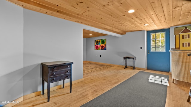 interior space featuring hardwood / wood-style floors and wood ceiling